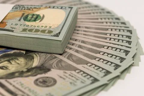Stack of money in US dollars cash banknotes Stock Photos