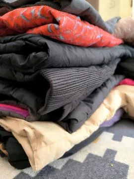 A stack of mountaineering jackets Stock Photos