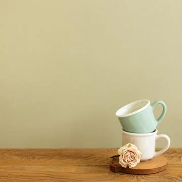 Stack of mug cup on wooden table. khaki beige background Stock Photos