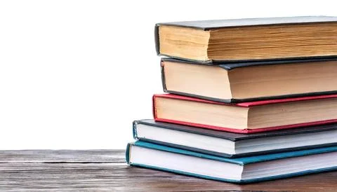 Stack of multi colored school books isolated on white background with copy .. Stock Photos