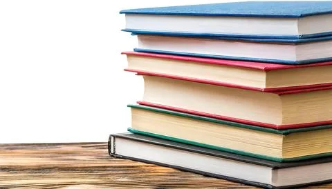 Stack of multi colored school books isolated on white background with copy .. Stock Photos