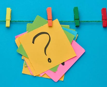 A stack of multi-colored square sticky notes with a question mark on them, .. Stock Photos