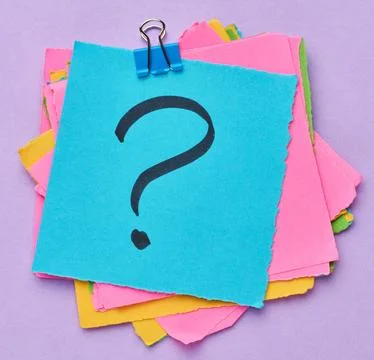 A stack of multi-colored square sticky notes with a question mark on them, .. Stock Photos