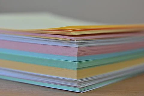 Stack of multi-colored stickers close-up. pastel paper Stock Photos