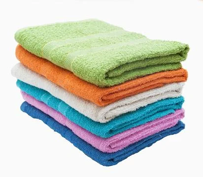 Stack of multi-colored terry towels on a white background Stock Photos