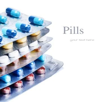 Stack of multicolor medicine pills Stock Photos