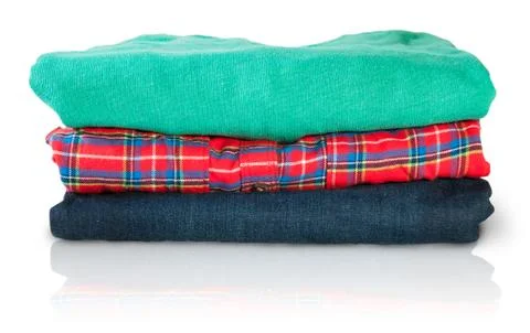 Stack of multicolored casual clothes Stock Photos
