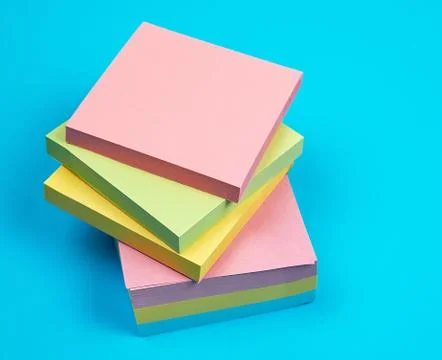 Stack of multicolored empty paper square stickers Stock Photos