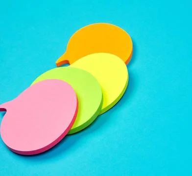 Stack of multicolored empty paper stickers in the form of clouds 库存照片