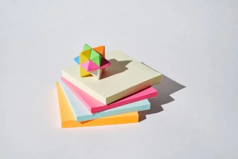 Stack of multicoloured paper stickers on a white background. Stock Photos