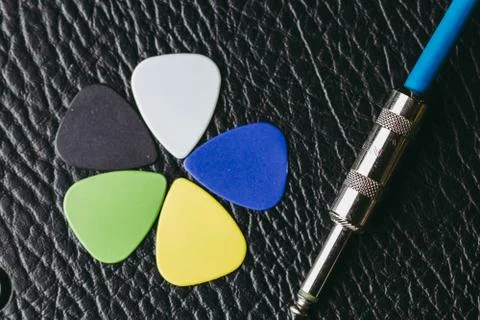 Stack of multiple multi colored guitar pick Photos