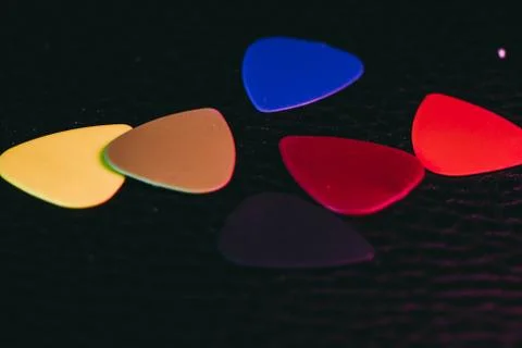Stack of multiple multi colored guitar pick Photos