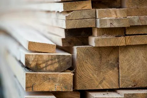 Stack of natural brown uneven rough wooden boards different size, cross-secti Stock Photos