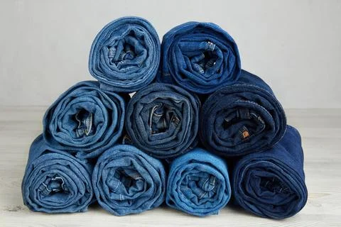 A stack of neatly rolled jeans Foto stock
