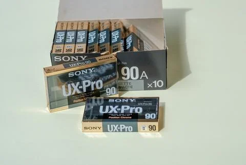 Stack of new black gold audio cassettes Sony UIX Pro 90 with cardstock box. Stock Photos