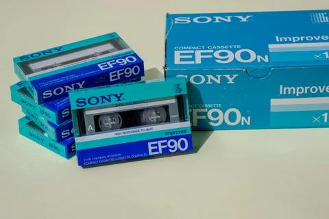 Stack of new blue audio cassettes Sony of 90 minutes with cardstock box. Stock Photos