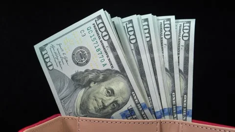 Stack of new blue hundred dollar bills in a wallet Stock Footage 346911738