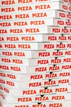 Stack of new cardboard pizza boxes Stock Photos
