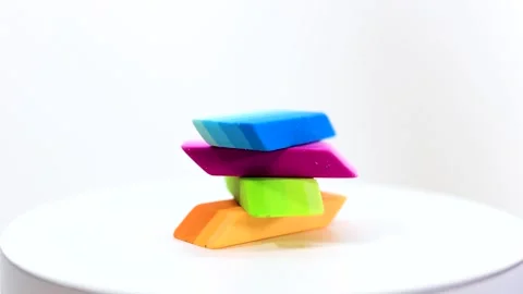 Stack of new colorful erasers on white background Video stock 294448754