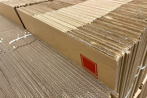 Stack of new Disassembled condition packaging corrugated carboard boxes. lo.. Stock Photos