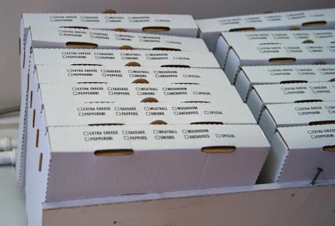 Stack of new generic pizza boxes ready to be used. Stock Photos