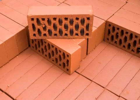 A stack of new red clay bricks Foto stock
