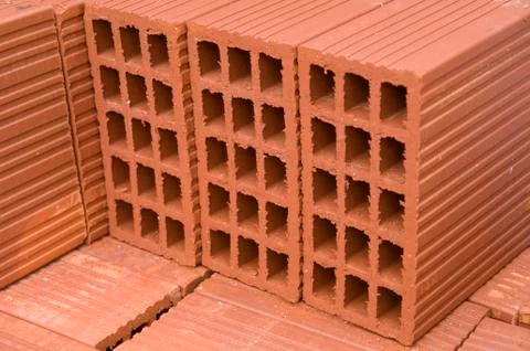 A stack of new red clay bricks Foto stock