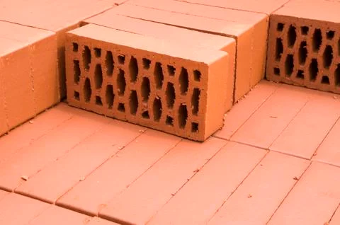 A stack of new red clay bricks Foto stock