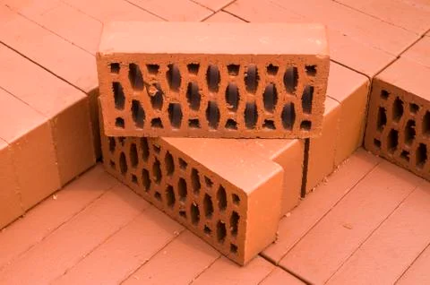 A stack of new red clay bricks Foto stock