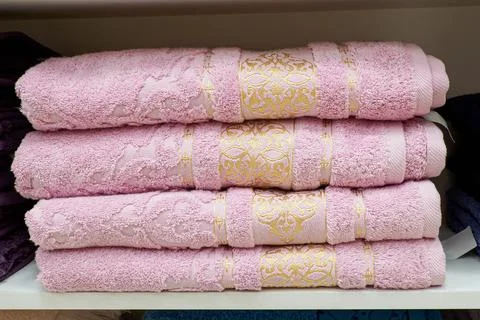 A stack of new towels. Bath accessories. Textile industry. Retail trade Stock Photos
