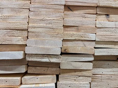 A stack of new wood panels on a construction site. Industrial background. Stock Photos