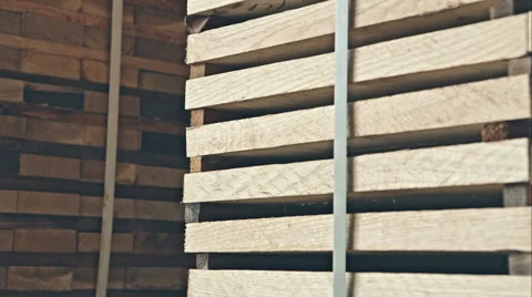 Stack of new wooden studs at the lumber yard. RAW video record Vídeo Stock 60704924