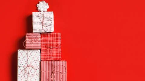 Stack of new year gift box in the shape of a Christmas tree Stock Photos