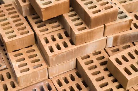 A stack of new yellow clay bricks Foto stock