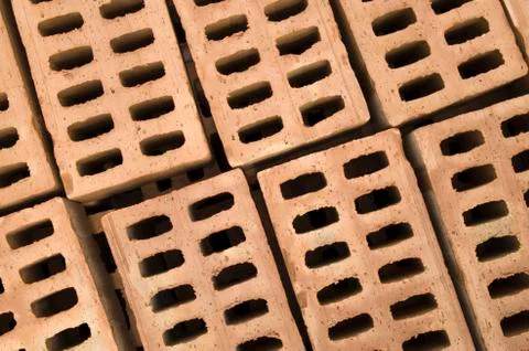 A stack of new yellow clay bricks Foto stock