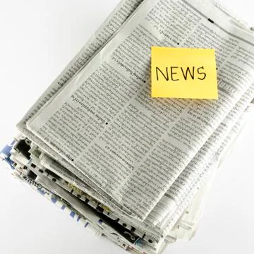 Stack of newspaper with post it write news word Stock Photos