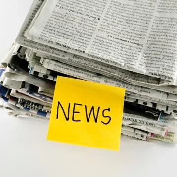 Stack of newspaper with post it write news word Stock Photos