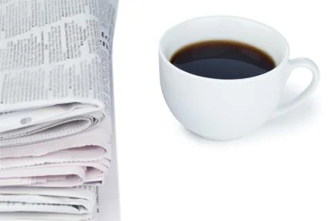 Stack of newspapers and cup of coffee Foto stock