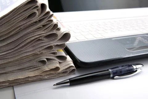 Stack of newspapers and keyboard close-up Foto stock
