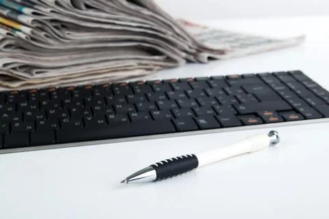 Stack of newspapers and keyboard close-up Stock Photos