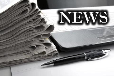 Stack of newspapers and keyboard close-up Stock-Fotos