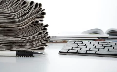Stack of newspapers and keyboard Stock Photos