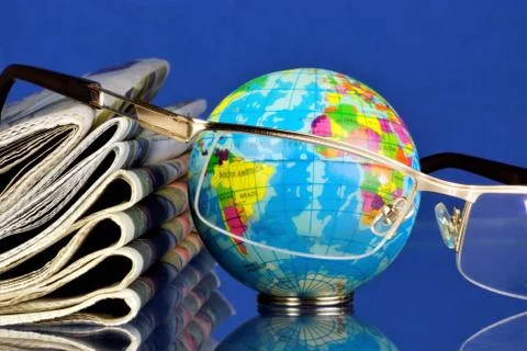 A stack of Newspapers, glasses for reading world news. Stock Photos