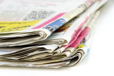 Stack of newspapers isolated on white background Stock Photos