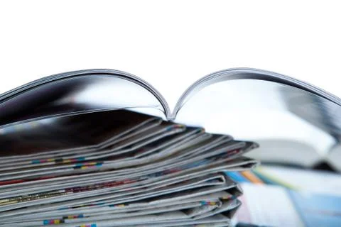 Stack of newspapers, magazine, and keyboard close-up Stock Photos