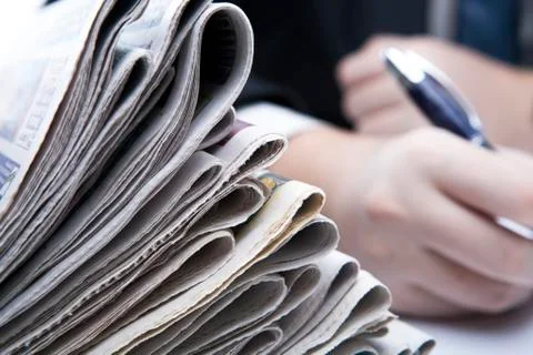 Stack of newspapers in office close-up Stock Photos