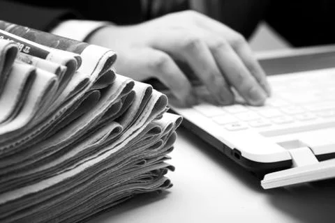 Stack of newspapers in office close-up Stock Photos