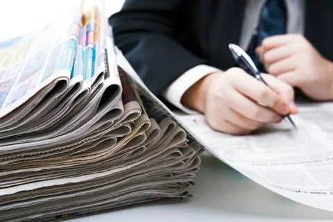 Stack of newspapers in office close-up Stock Photos
