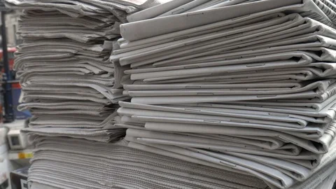Stack of newspapers at Oxford Circus Stock Footage 91461307
