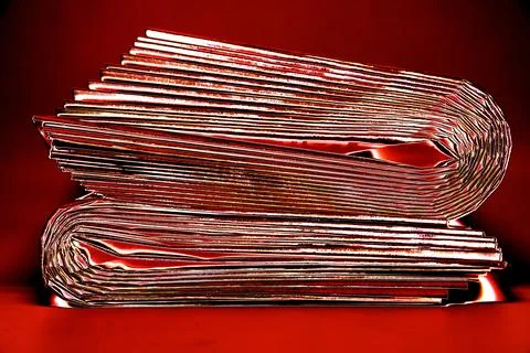 A stack of newspapers. They are ready for distribution to readers. Changed co Stock Photos
